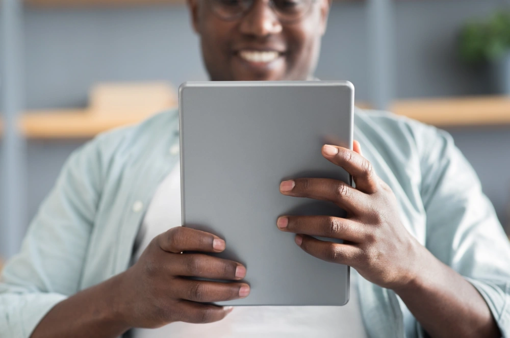 man reading a tablet